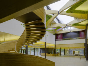 spiral staircase and decorative timber features inside a visitor centre
