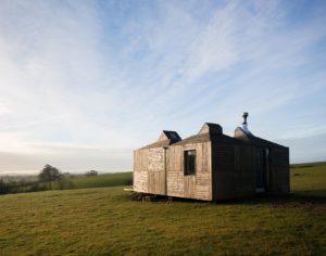 bothy sitting in a field at dusk