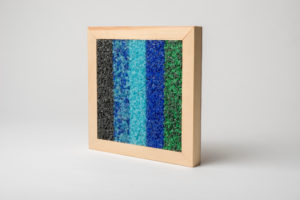 frame containing multicoloured glass paving material