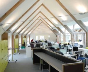 office interior of a curved building with a v shaped roof