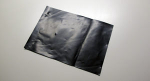 sheet of black membrane on a table