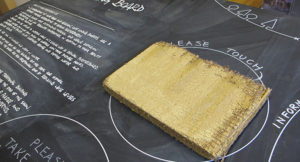clay lining board sample on a blackboard table top with text