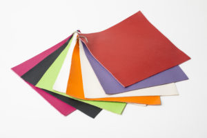 eight leather samples displayed on a wite background