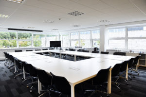 inside an office at Construction Scotland Innovation Centre with large tables and chairs