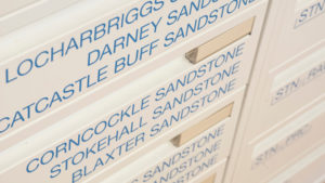 close up of file cabinets with names of stone types on it