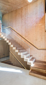 CLT staircase with CLY walls and string steel banister