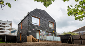 two storey house clad in reclaimed slate